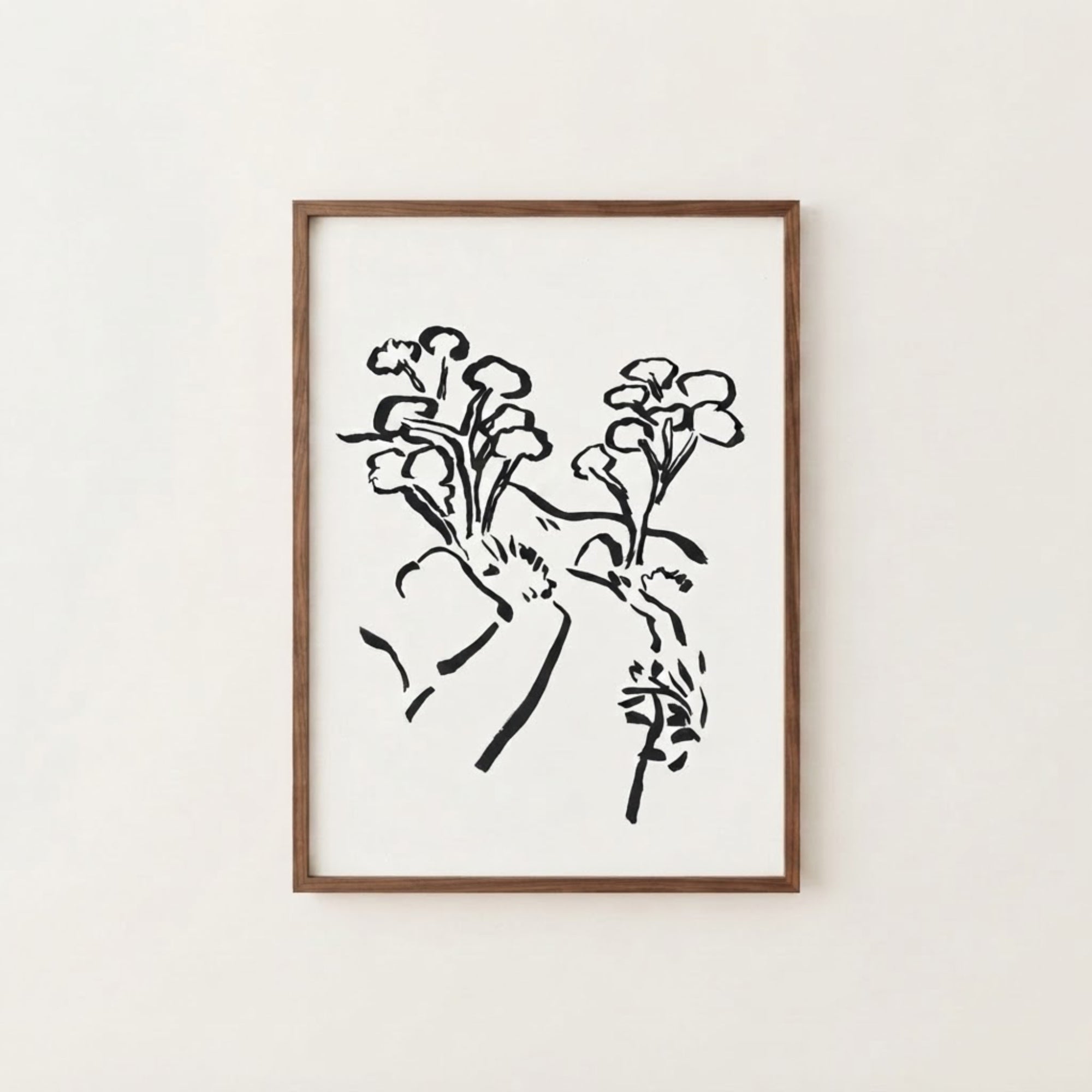 The image is a framed artwork depicting a stylized floral design in black and white.