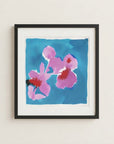 The image is a framed painting of two pink flowers against a blue background.