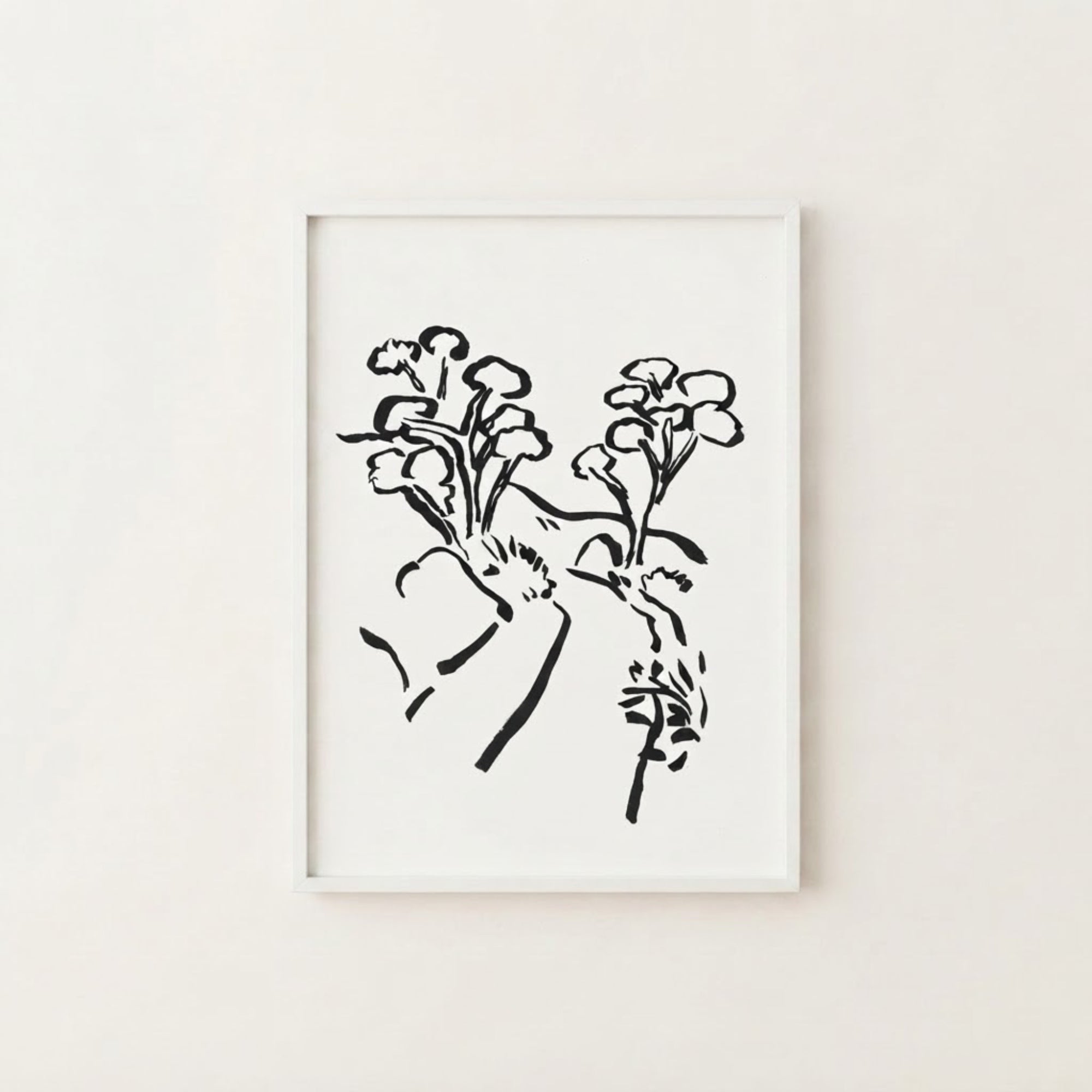 The image is a framed black and white illustration of a stylized floral design.