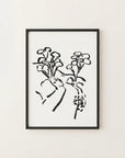 The image is a black and white abstract art print featuring stylized floral or plant-like shapes in a minimalist, sketchy style.